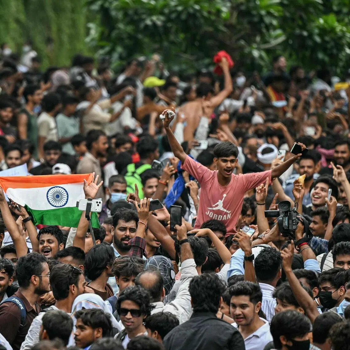 Cockroach Janta Party supporters celebrate the resignation of India’s Education Minister Dharmendra Pradhan, at Jantar Mantar in New Delhi, on July 25.