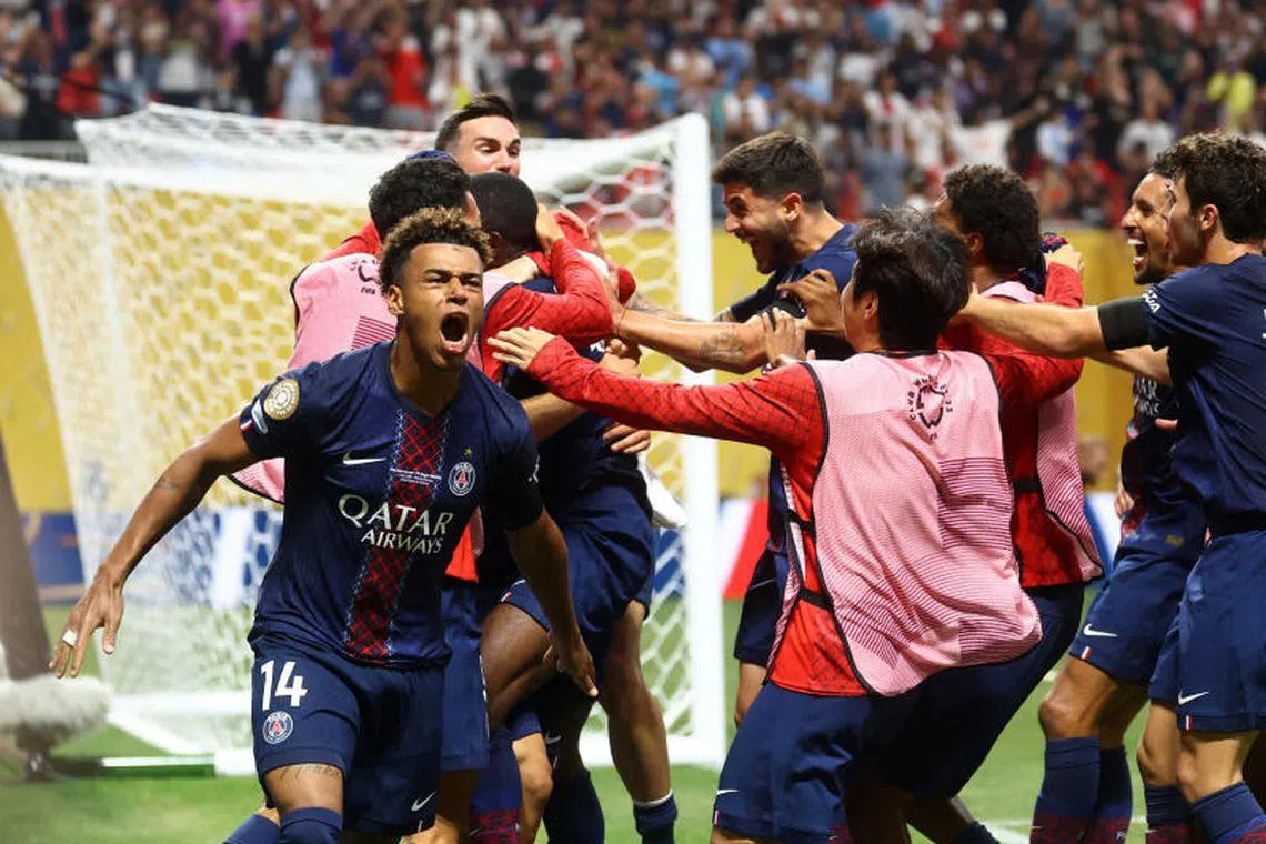 Paris St Germain's Desire Doue celebrates after Ousmane Dembele scores their second goal.