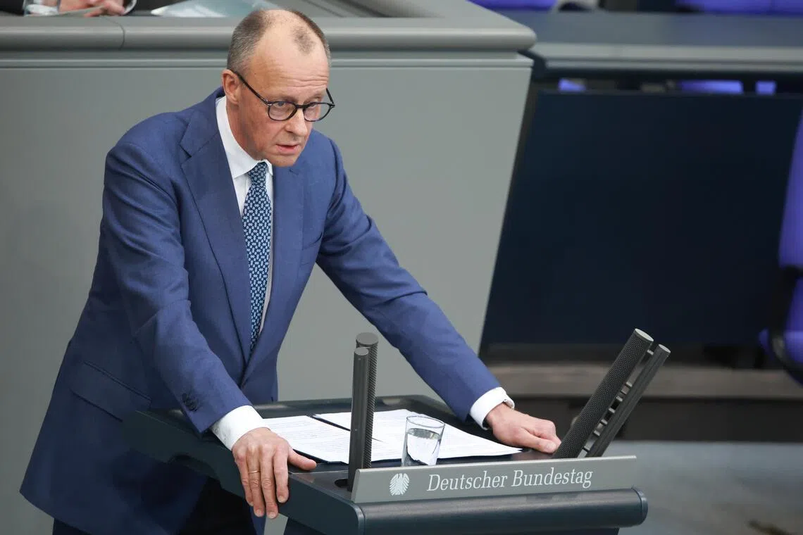 German Chancellor Friedrich Merz delivering a speech on March 18 at the German Parliament building in Berlin.