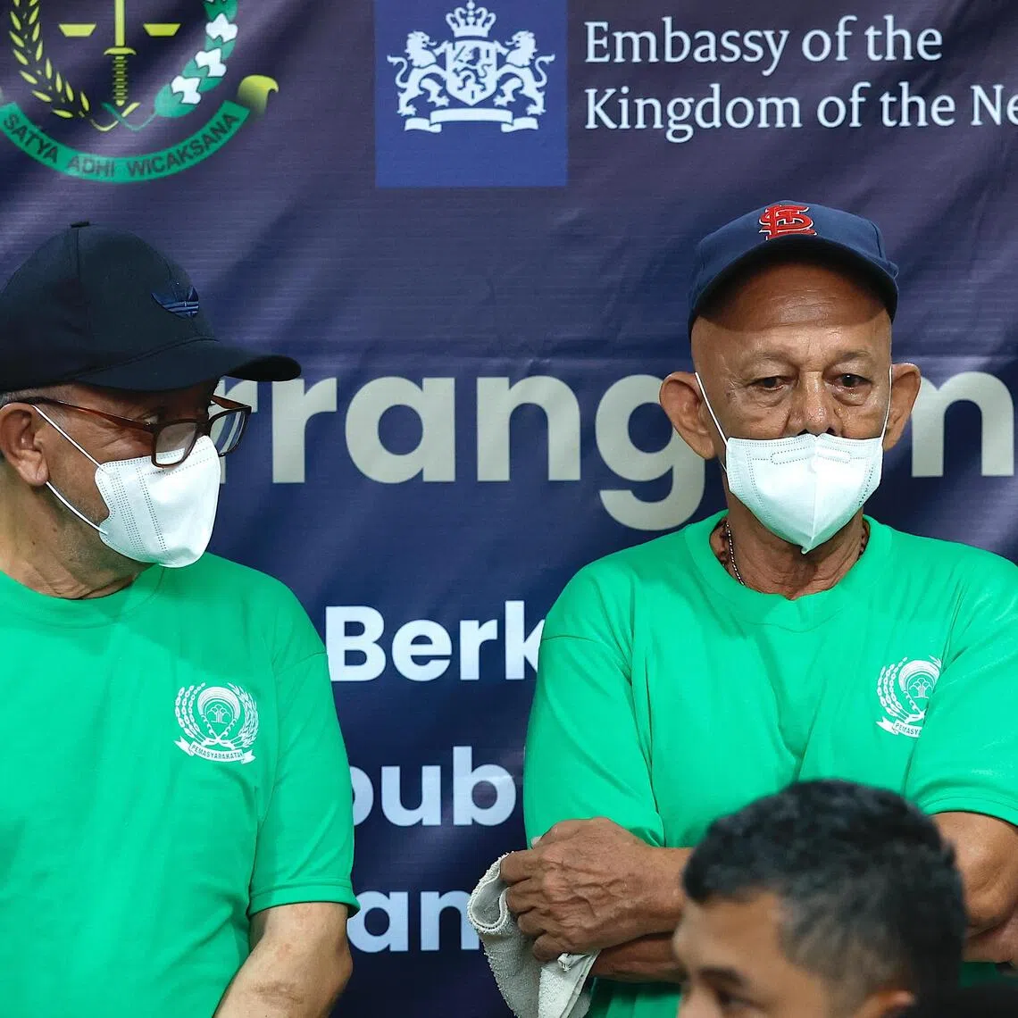 Dutch life-sentenced prisoner Ali Tokman (left) and death row convict Siegfried Mets (right) attend a handover ceremony for their repatriation at Cipinang Prison in Jakarta on Dec 8.
