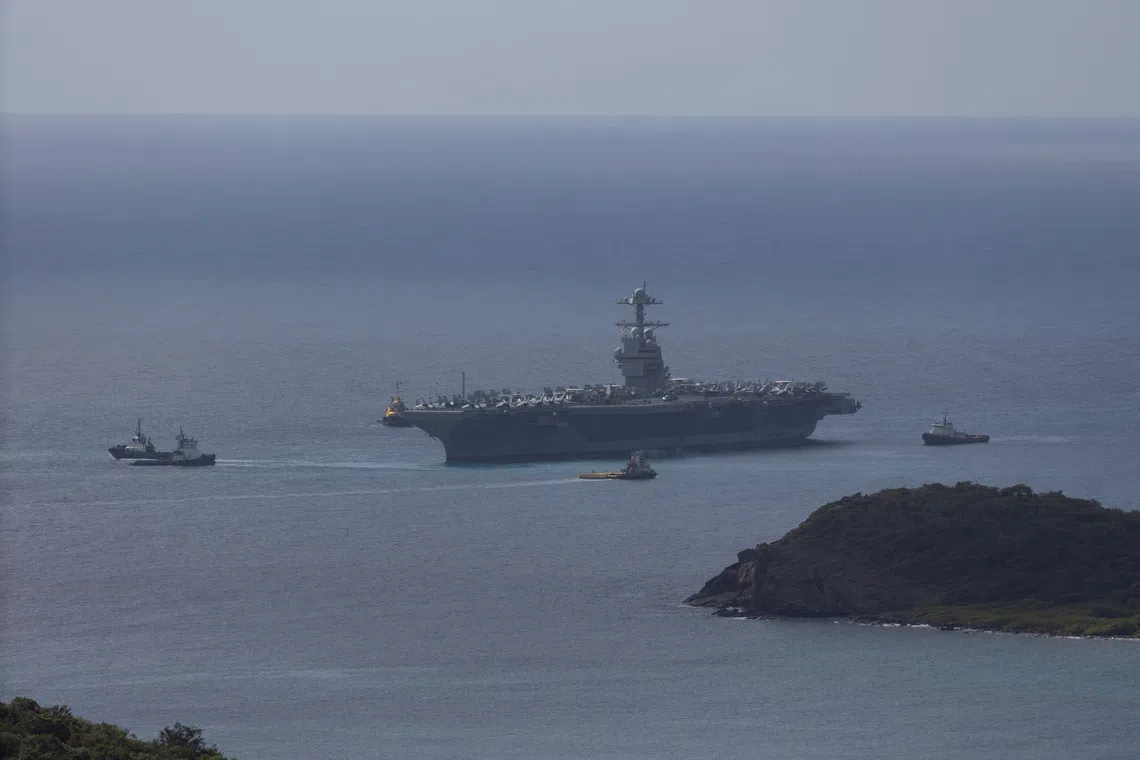 The U.S. Navy USS Gerald R. Ford aircraft carrier (CVN-78) is moved by tug boats near Saint Thomas, U.S. Virgin Islands, December 1, 2025. REUTERS/Marco Bello