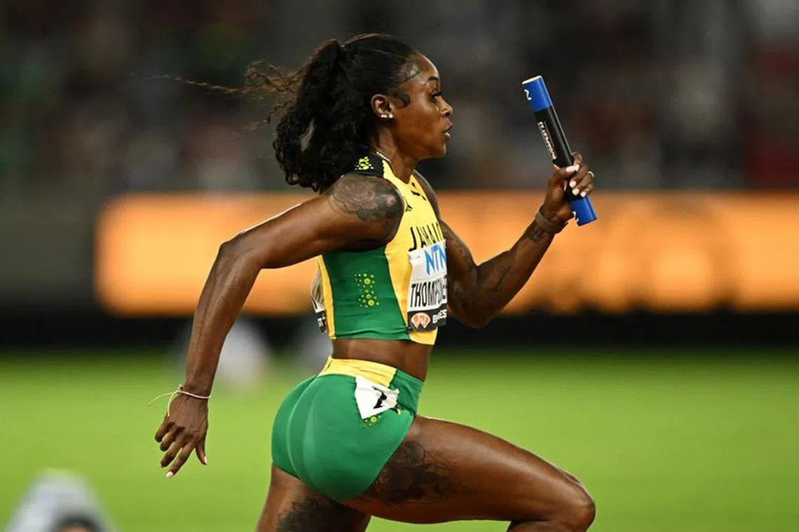 FILE PHOTO: Athletics - World Athletics Championship - Women's 4x100m Relay Heats - National Athletics Centre, Budapest, Hungary - August 25, 2023 Jamaica's Elaine Thompson-Herah  in action during heat 1 REUTERS/Dylan Martinez/File Photo