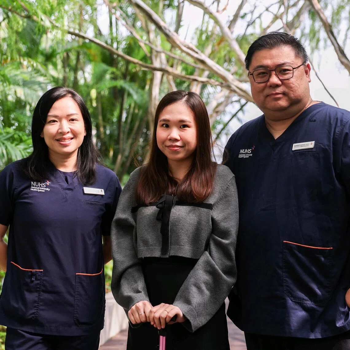 Small fibre neuropathy patient Louisa Lim (centre) with her doctors Amanda Chan and Kewin Siah.