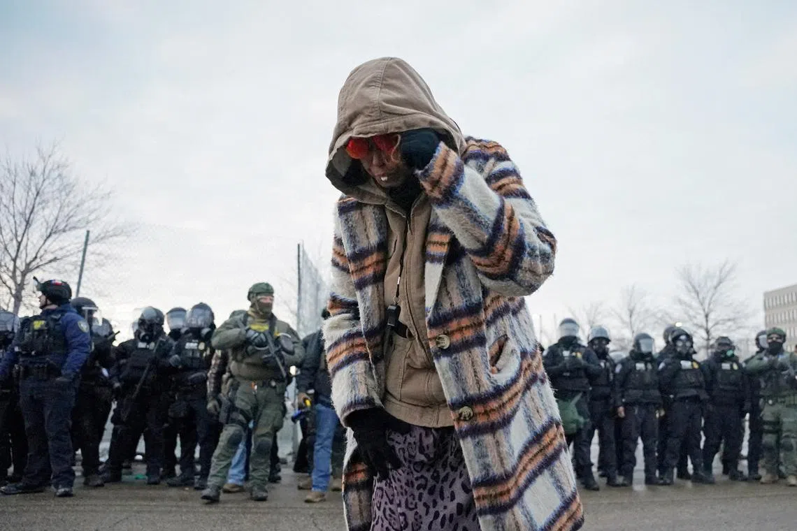 A woman struck by pepper balls during a protest more than a week after a US ICE agent fatally shot Ms Renee Nicole Good, in Minnesota, on Jan 17.