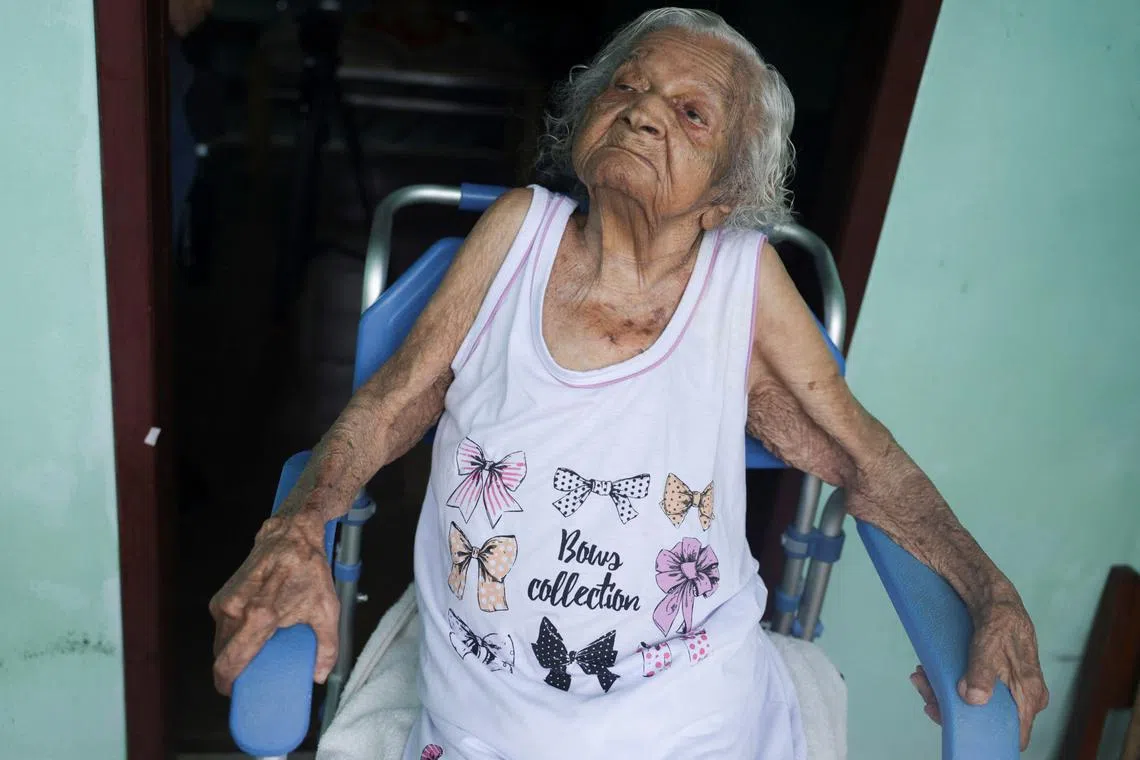 Deolira Gliceria Pedro da Silva, 119, sits in her house in Itaperuna, Rio de Janeiro state, Brazil, January 14, 2025. REUTERS/Ricardo Moraes