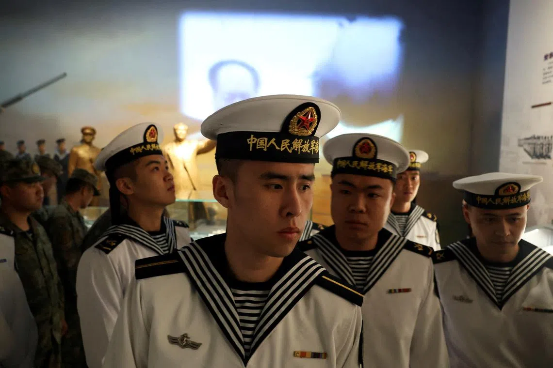 FILE PHOTO: Members of the Chinese People's Liberation Army (PLA) Navy visit the PLA Naval Museum on the Navy's 75th founding anniversary, in Qingdao, Shandong province, China April 23, 2024. REUTERS/Florence Lo/File Photo