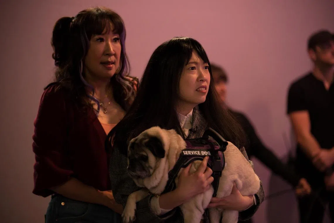 In Quiz Lady, Sandra Oh (left) and Awkwafina play sisters hoping to win some money on a game show. 