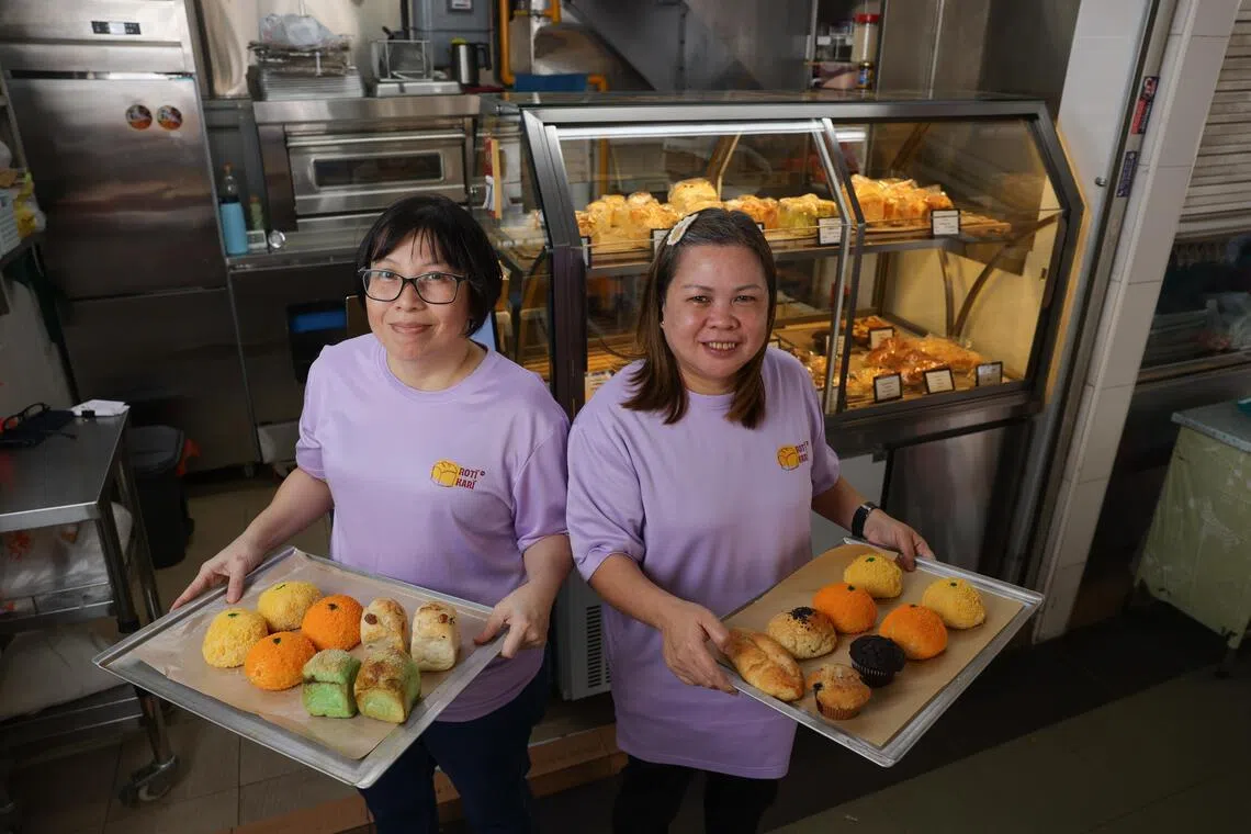Ex-convicts Yun Li Hua (left), 45 and Chris Wong, 52, manning a bread stall, Roti Kari. To create employment for female ex-offenders, a charity called Blessed Grace Social Services has partnered an F&B Group to run hawker stalls hiring the women ex-convicts. The women get paid a salary and some profit sharing for running these stalls selling bread. 