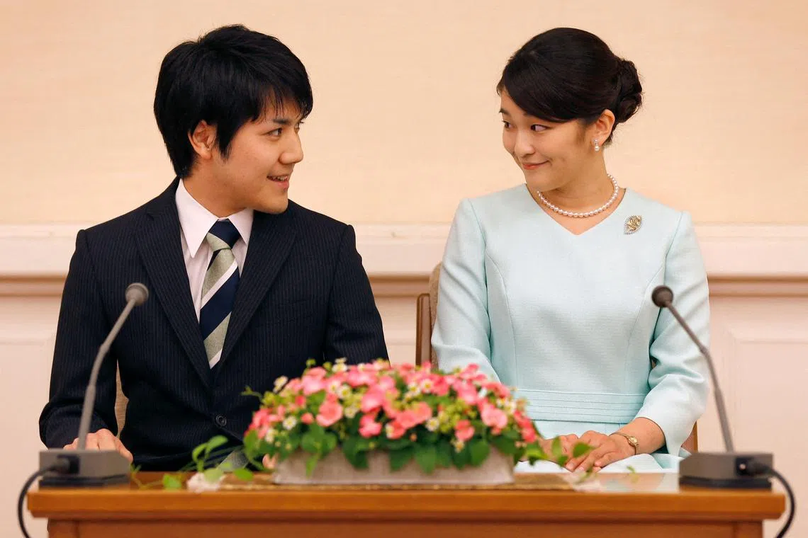 This file picture taken on September 3, 2017 shows Japan's Princess Mako, the eldest daughter of Prince Akishino and Princess Kiko, and her now-husband Kei Komuro at a press conference to announce their engagement in Tokyo in September 2017. 