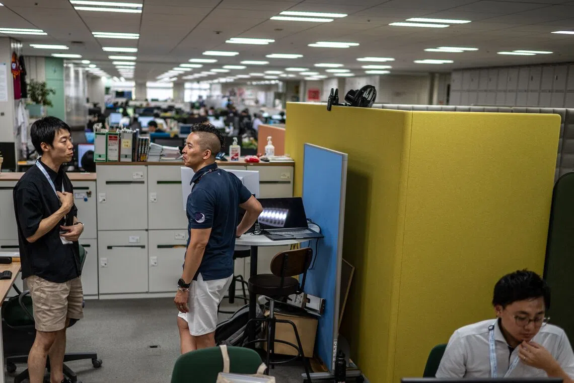 Government officials in casual dress code, including shorts, tee shirts and sneakers, as part of Tokyo’s ‘Cool Biz’ initiative.