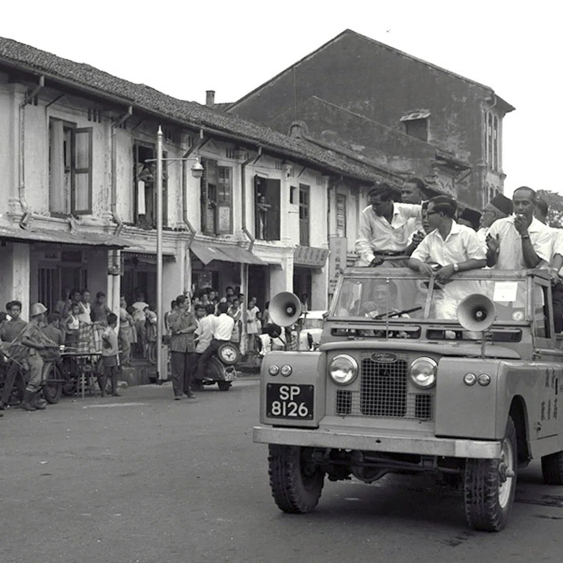 Singapore’s then Culture Minister S. Rajaratnam and Deputy Prime Minister Toh Chin Chye visiting riot-stricken areas in their wards in an open-top vehicle on July 24, 1964, after the day’s curfew ended.