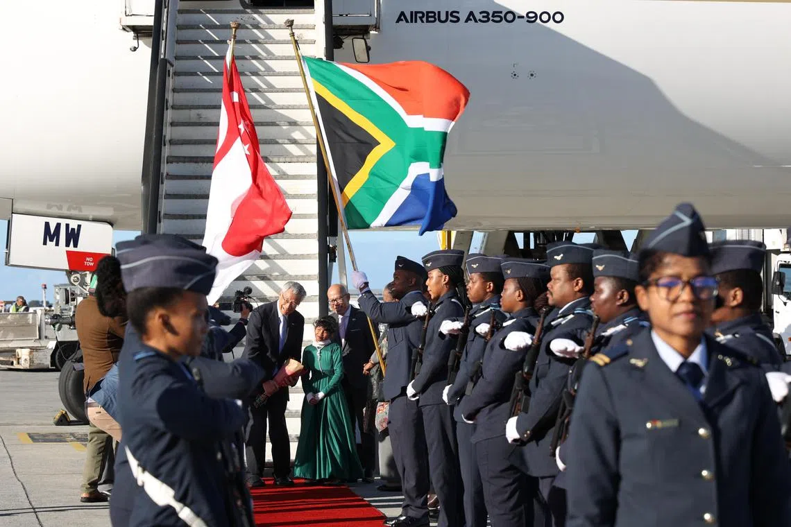 CMG20230514-OA-HoKJ01  Prime Minister Lee Hsien Loong is welcomed by South African Minister of International Relations and Cooperation Naledi Pandor at Cape Town International Airport in Cape Town, South Africa on Sunday, 14 May.  A silent guard will be present and there will be a presentation of a flower bouquet to the PM by a child. High Commissioner to South Africa, Mr Zainal Arif Mantaha, posed for photo with PM and the girl. PM Lee will be making a six-day official visit to South Africa and Kenya from Sunday to Friday. These are Prime Minister Lee’s first Official Visits to South Africa and Kenya.