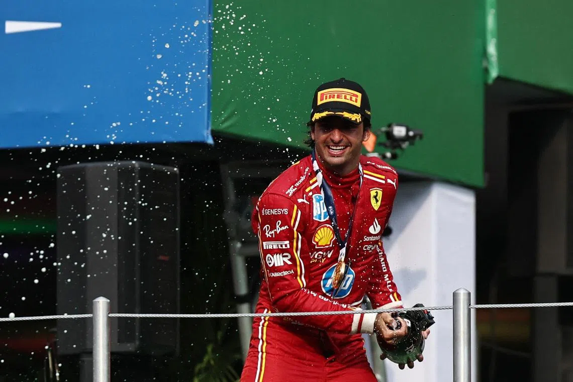 Ferrari's Formula One driver Carlos Sainz celebrating on the podium after winning the Mexico City Grand Prix on Oct 27. 