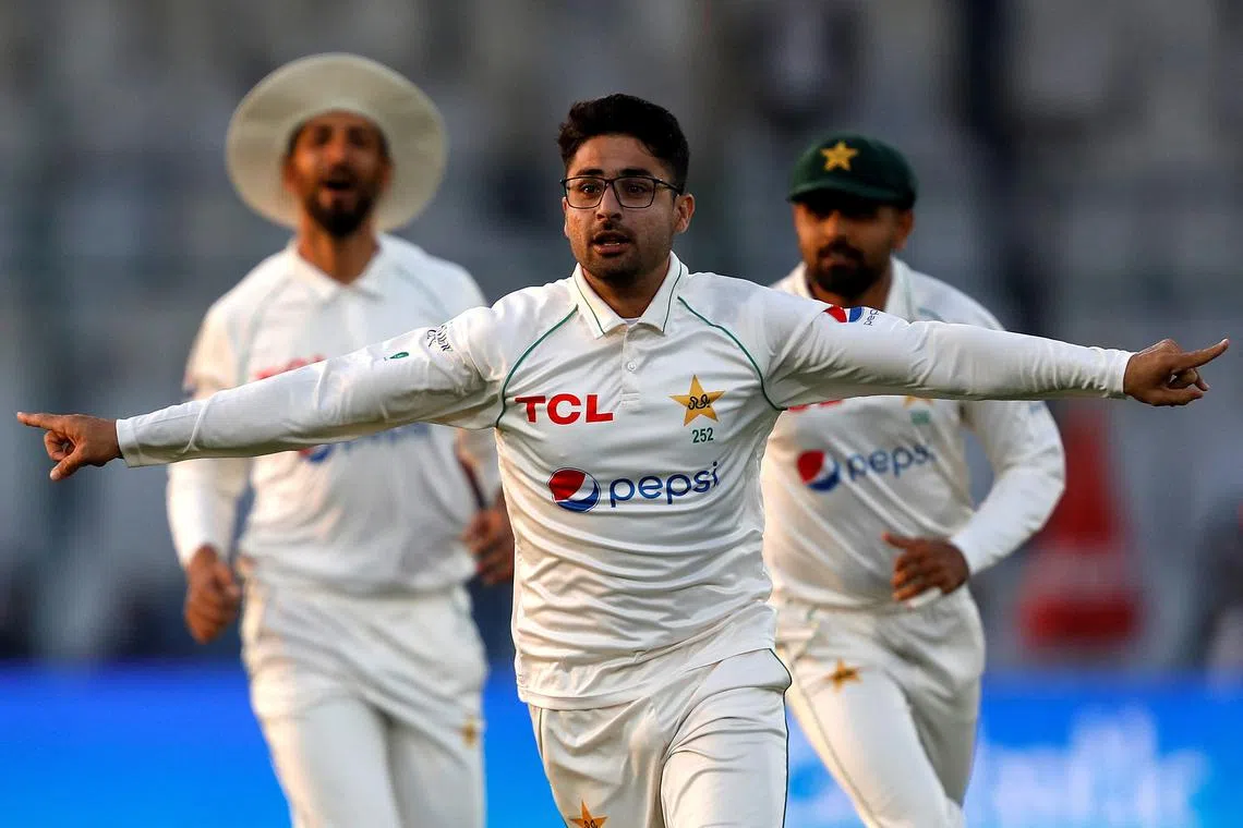 FILE PHOTO: Cricket - Third Test - Pakistan v England - National Stadium Karachi, Pakistan - December 17, 2022. Pakistan's Abrar Ahmed celebrates taking the wicket of England's Zak Crawley. REUTERS/Akhtar Soomro/File photo