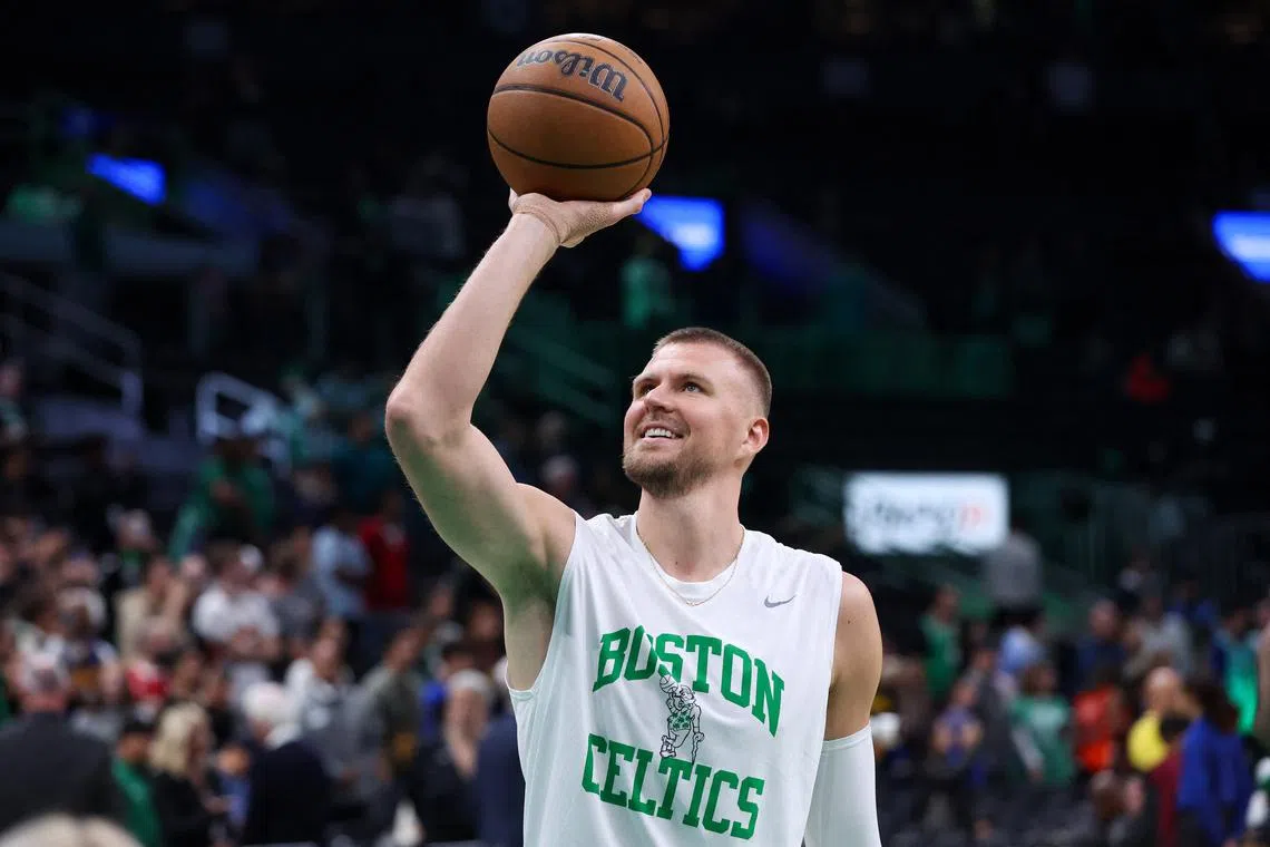 Nov 6, 2024; Boston, Massachusetts, USA; Boston Celtics center Kristaps Porzingis (8) warms up before playing against the Golden State Warriors at TD Garden. Mandatory Credit: Paul Rutherford-Imagn Images/ File Photo