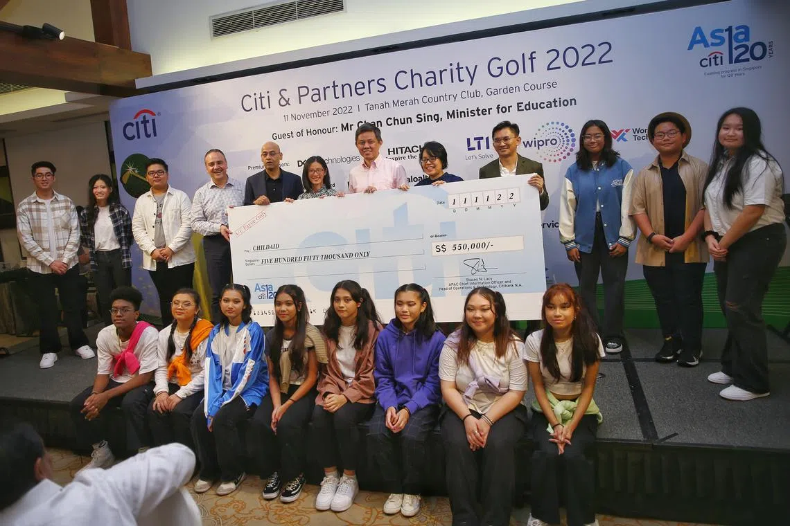 Education Minister Chan Chun Sing (standing, sixth from right) at the 18th annual Citi & Partners Charity Golf event.