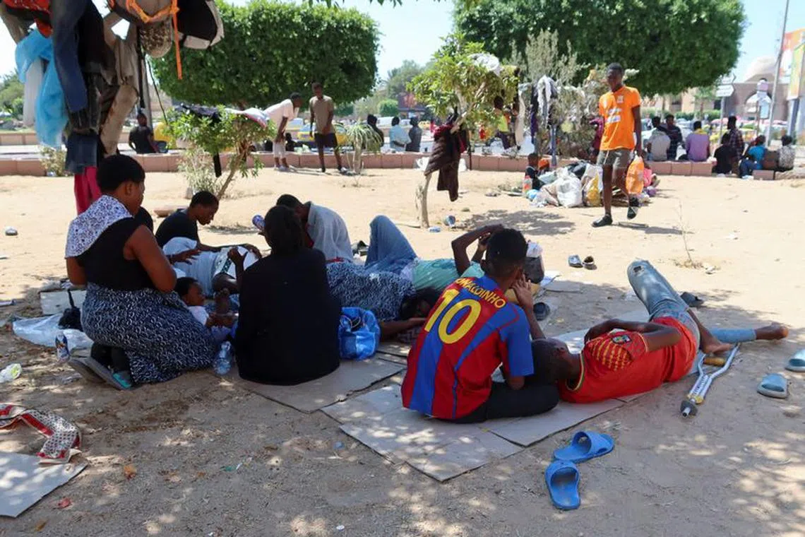 African migrants gather in a public garden in Sfax, Tunisia July 13, 2023. REUTERS/Jihed Abidellaoui/File Photo