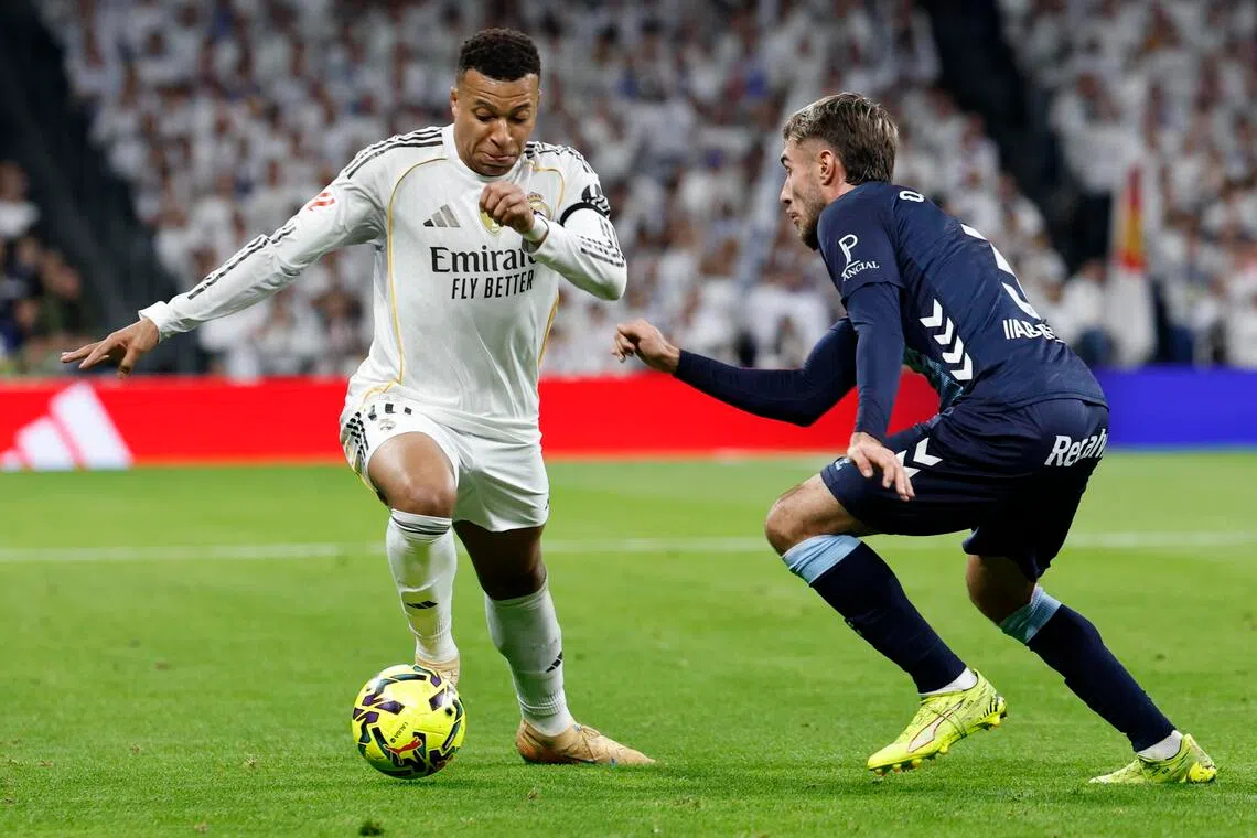 Real Madrid's Kylian Mbappe in action against Celta's Oscar Mingueza during the their La Liga match.