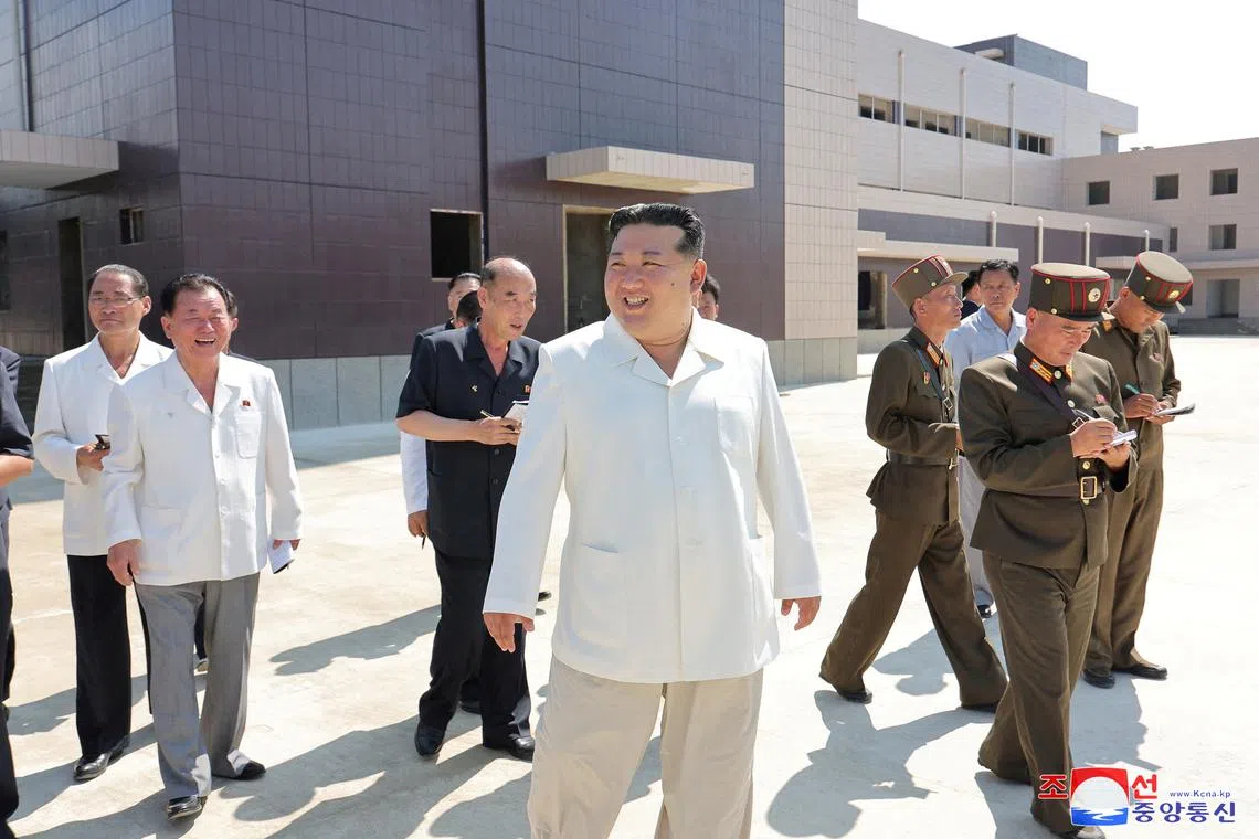 FILE PHOTO: North Korean leader Kim Jong Un smiles while on a visit to the construction sites of various North Korean industrial factories on Saturday and Sunday, at an undisclosed location in North Korea, in this undated photo released by North Korea's official Korean Central News Agency August 26, 2024.    KCNA via REUTERS/ File Photo