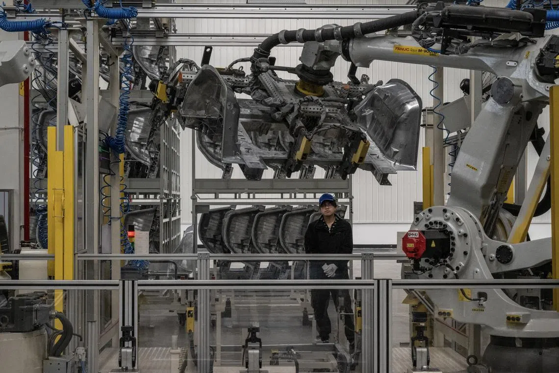 FILE — A worker on the electric car assembly line at Zeekr’s assembly plant in Ningbo, China, on April 9, 2024. Heavy subsidies for industry, together with weak sales in China, have set the stage for an export boom, raising fears of factory job losses elsewhere. (Gilles Sabrié/The New York Times)