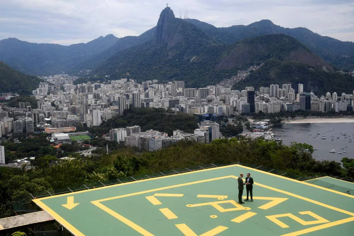 Britain's Prince William, Prince of Wales (L), speaking with Rio de Janeiro's mayor Eduardo Paes during the Welcome to Brazil event at Sugarloaf Mountain in Rio de Janeiro on Nov 3, 2025.