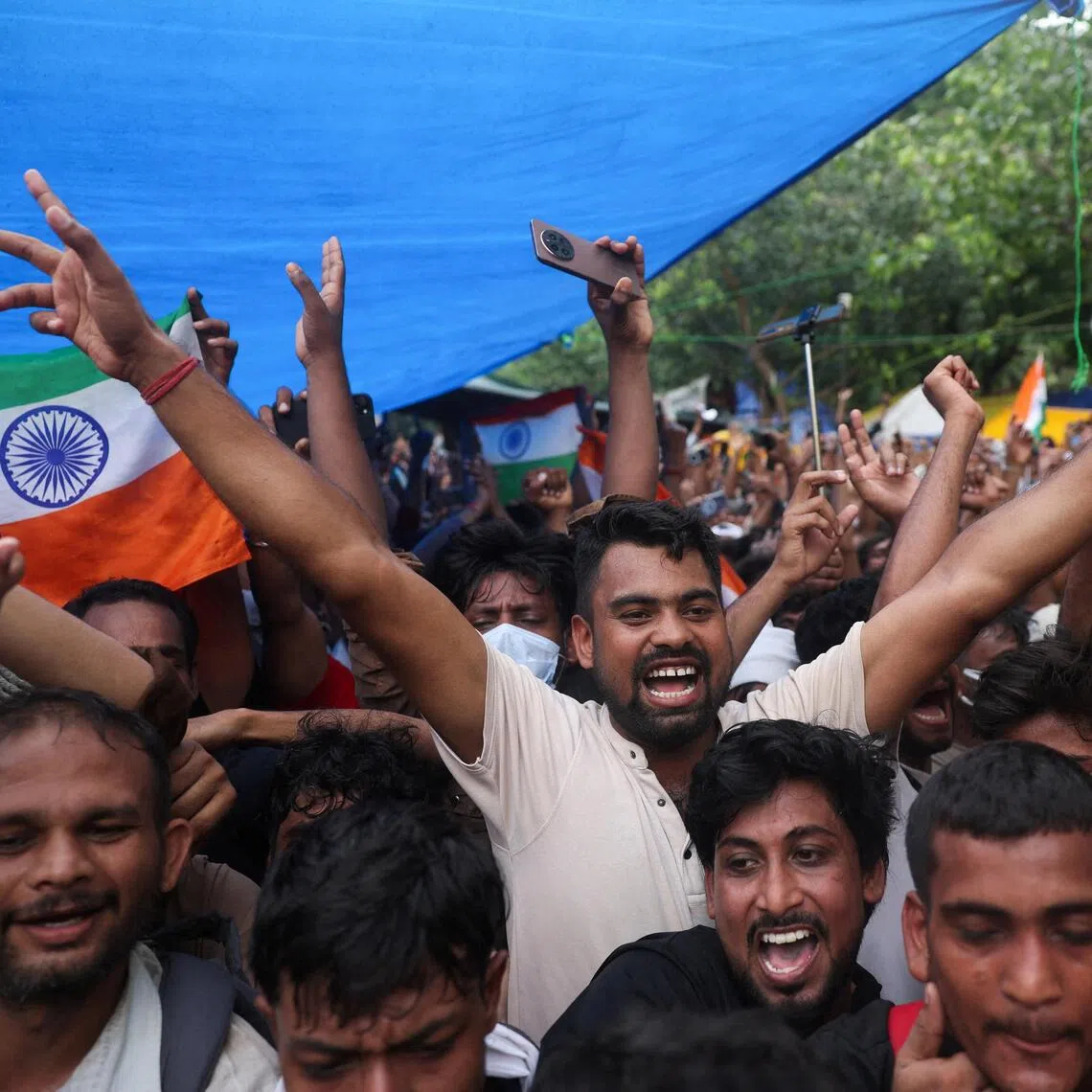 Cockroach Janta Party supporters celebrating in Jantar Mantar in New Delhi, after the resignation of Education Minister Dharmendra Pradhan on July 25.