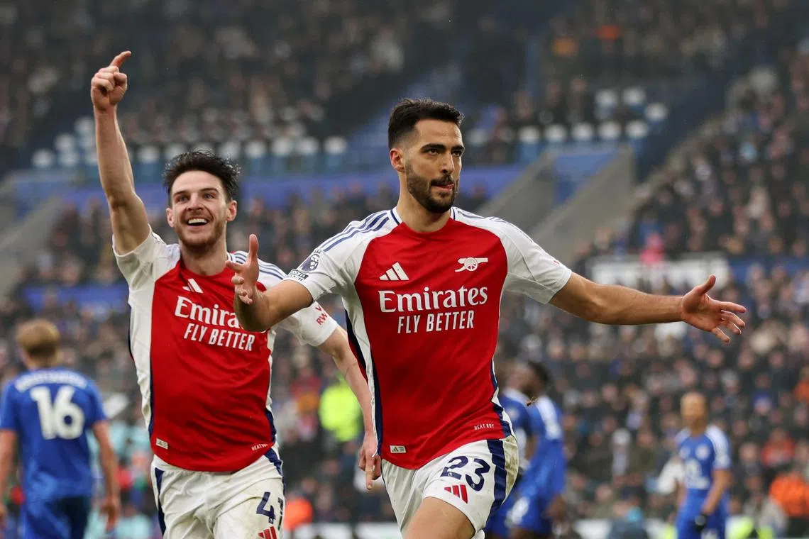 FILE PHOTO: Soccer Football - Premier League - Leicester City v Arsenal - King Power Stadium, Leicester, Britain - February 15, 2025 Arsenal's Mikel Merino celebrates scoring their first goal with Declan Rice REUTERS/Chris Radburn/File Photo