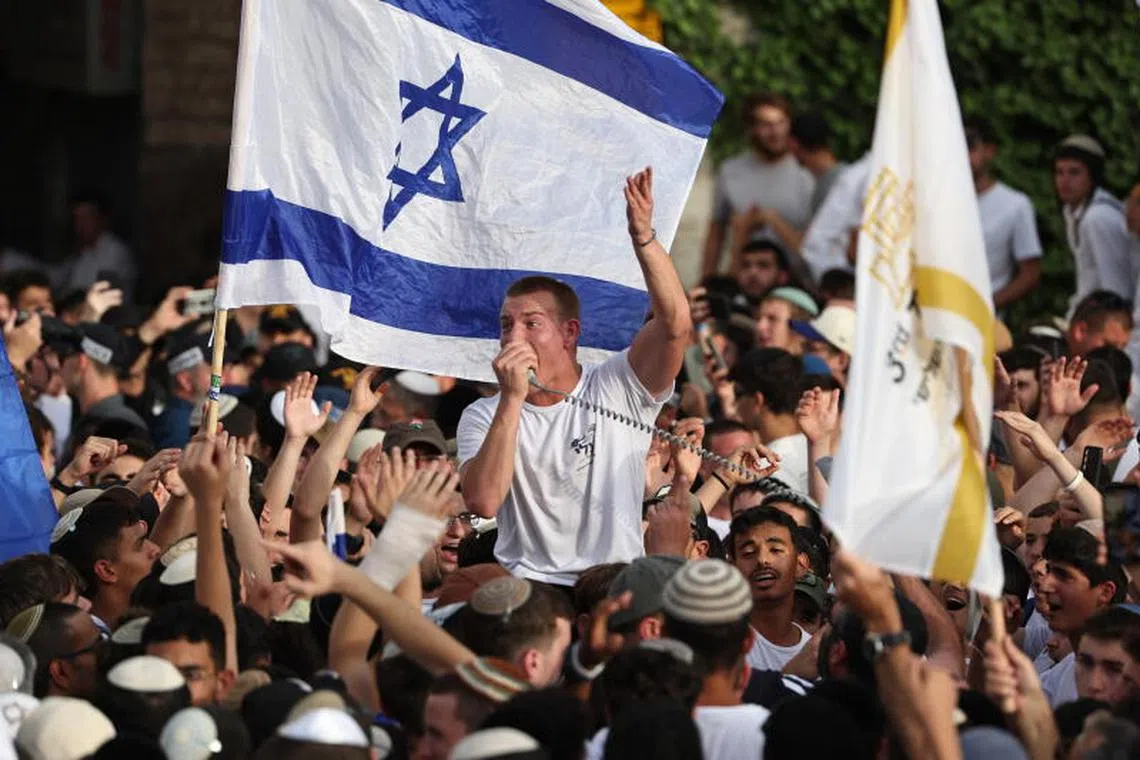 Caption:
epa12137318 Right-wing Israelis gather near Damascus Gate during the Israeli 'Flag March' in the Old City of Jerusalem, 26 May 2025. The annual right-wing Israeli 'Flag March' commemorates the establishment of Israeli control over the Old City of Jerusalem after the six-day war in 1967. Celebrating Jerusalem Day has long been viewed by Palestinians as a provocation. EPA-EFE/ATEF SAFADI