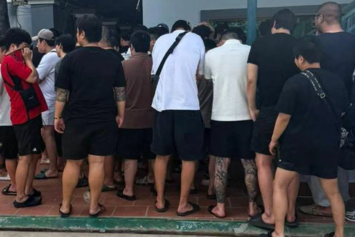 This handout photo shows some of the suspects rounded up during a raid on an online scam operation in Phnom Penh in October.
