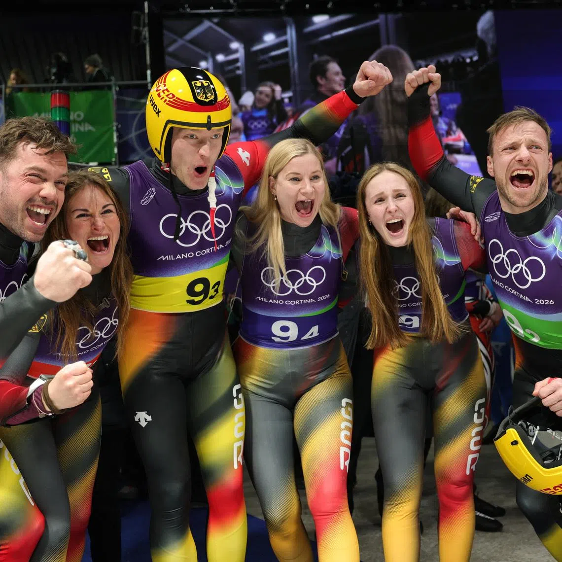 Milano Cortina 2026 Olympics - Luge - Team Relay - Cortina Sliding Centre, Cortina d'Ampezzo, Italy - February 12, 2026. Julia Taubitz of Germany, Tobias Wendl of Germany, Tobias Arlt of Germany, Max Langenhan of Germany, Dajana Eitberger of Germany and Magdalena Matschina of Germany celebrate winning gold in the Team Relay REUTERS/Athit Perawongmetha