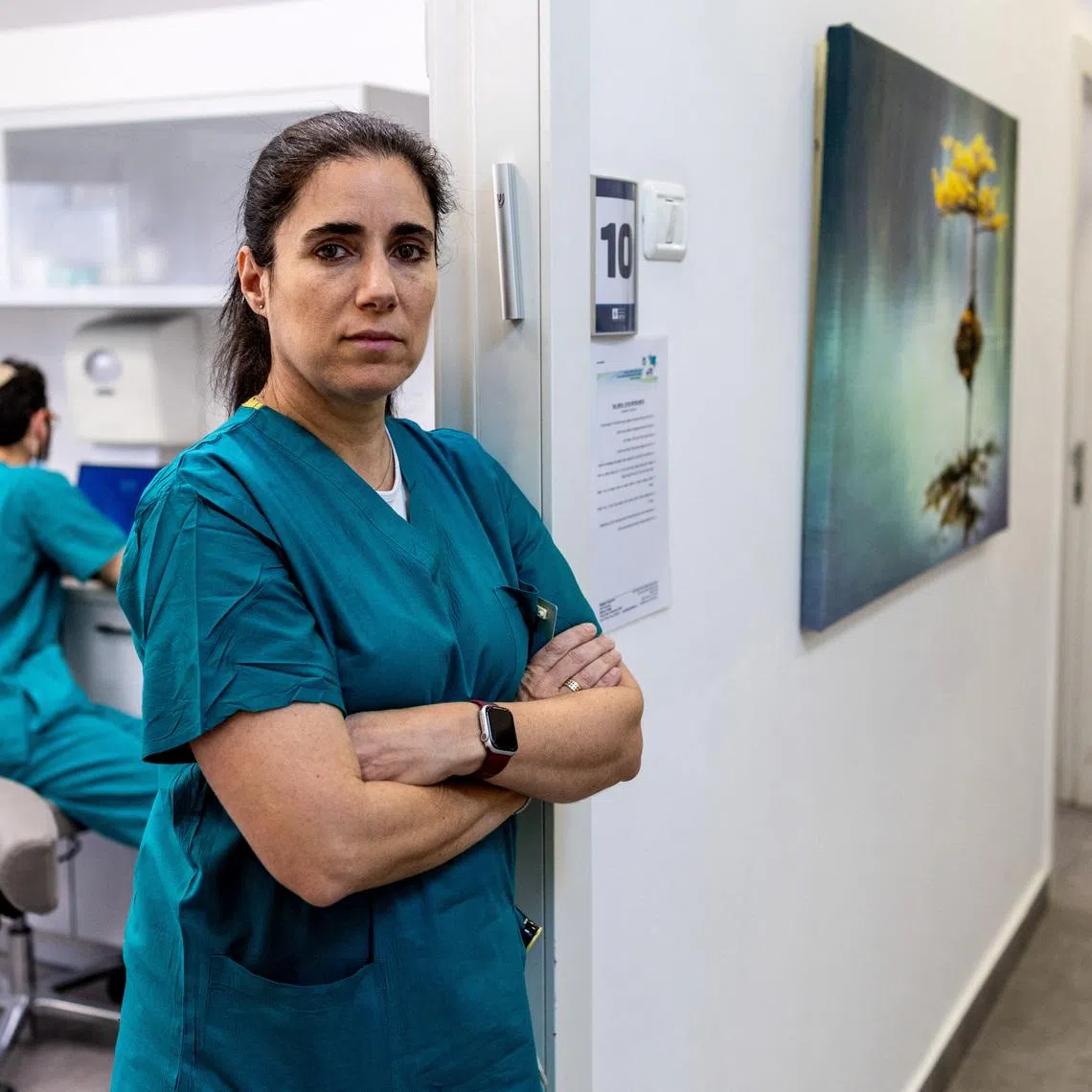 Forensic dentist Esi Sharon-Sagie, who has identified victims of Iranian missile strikes in Israel, victims of Hamas' October 7 attack, hostages and the body of Hamas leader Yahya Sinwar, poses for a photograph in her clinic during an interview with Reuters, in Jerusalem March 8, 2026. REUTERS/Ronen Zvulun