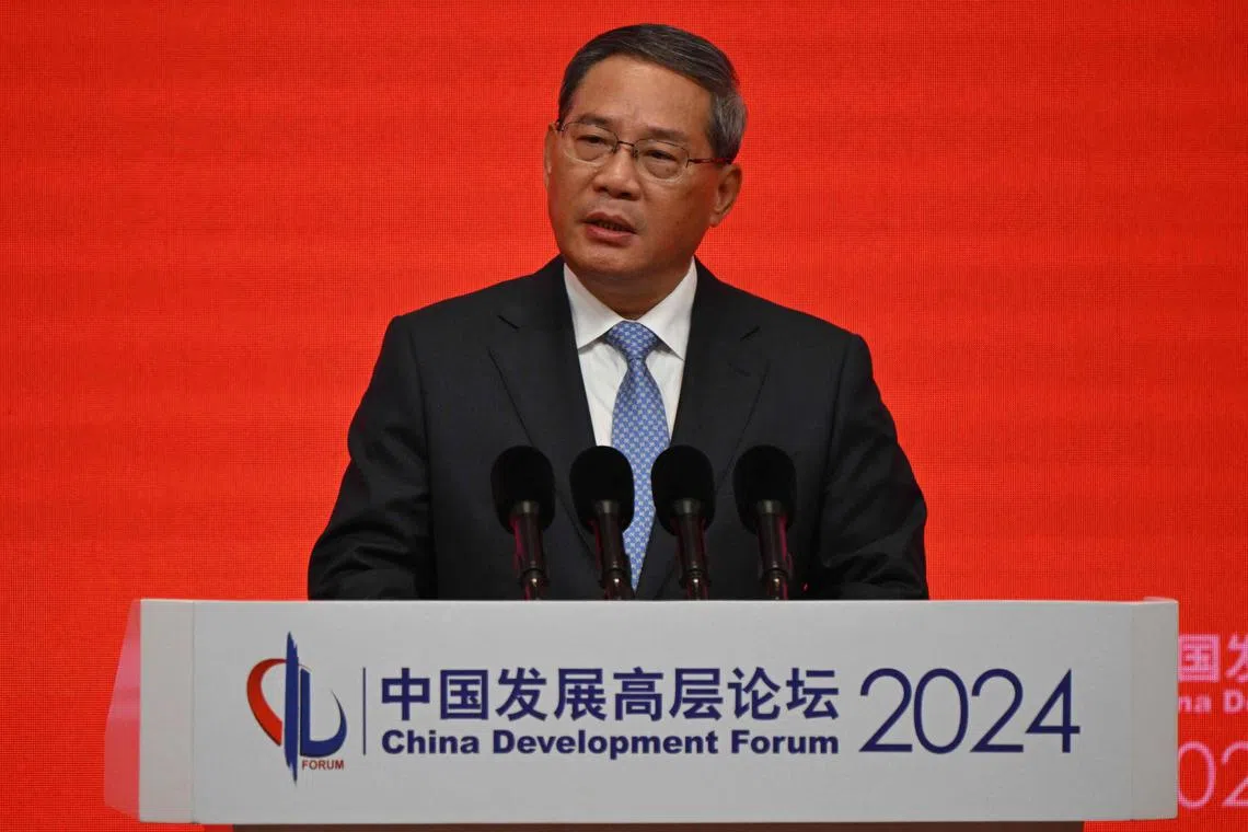 China's Premier Li Qiang delivers his speech during the China Development Forum in Beijing on March 24, 2024. (Photo by Pedro PARDO and Pedro Pardo / POOL / AFP)
