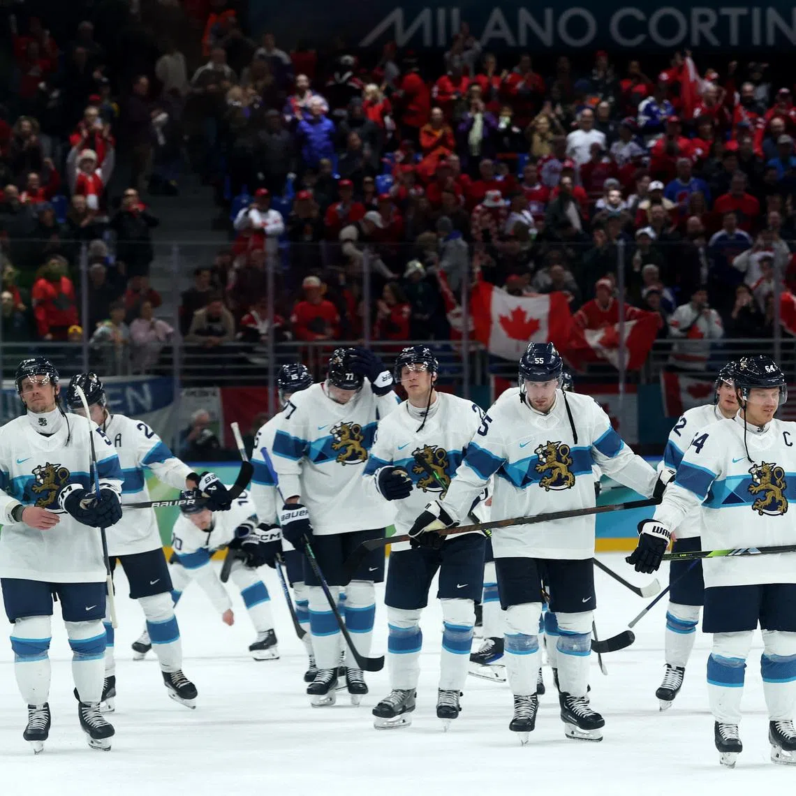 Milano Cortina 2026 Olympics - Ice Hockey - Men's Play-offs Semifinals - Canada vs Finland - Milano Santagiulia Ice Hockey Arena, Milan, Italy - February 20, 2026. Players of Finland look dejected after the match REUTERS/Mike Segar