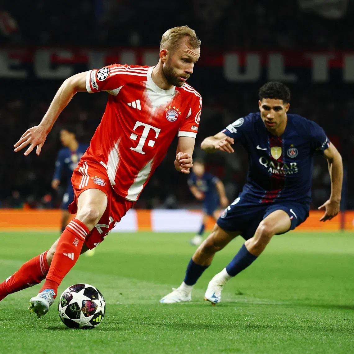 Soccer Football - UEFA Champions League - Semi Final - First Leg - Paris St Germain v Bayern Munich - Parc des Princes, Paris, France - April 28, 2026 Bayern Munich's Konrad Laimer in action with Paris St Germain's Achraf Hakimi REUTERS/Sarah Meyssonnier