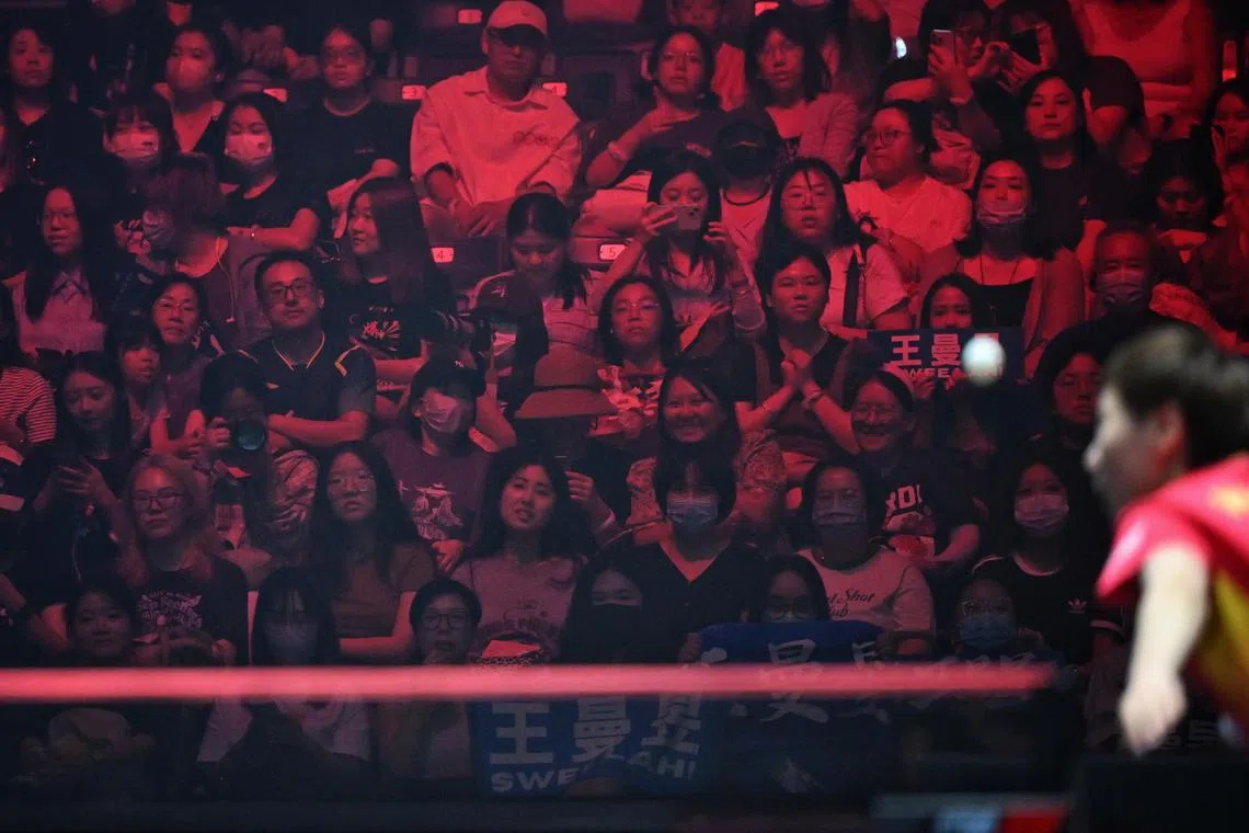 Spectators watching a match on the final day of the Singapore Smash competition held at the OCBC Arena on March 17, 2024.

