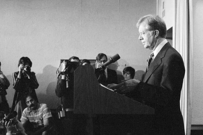 US President Jimmy Carter announcing sanctions against Iran in retaliation for taking American hostages in 1980 