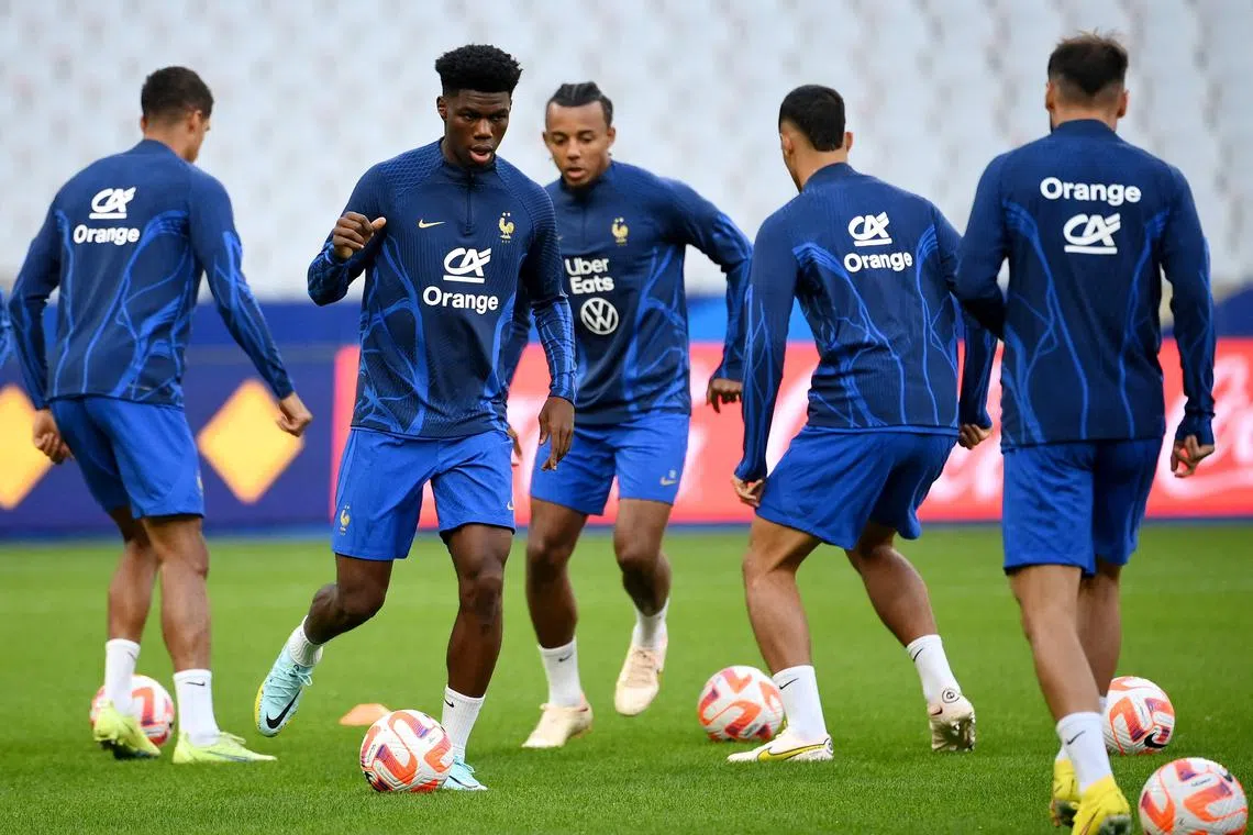 France's midfielder Aurelien Tchouameni (second from left) during a training session in Paris on Sept 21, 2022.