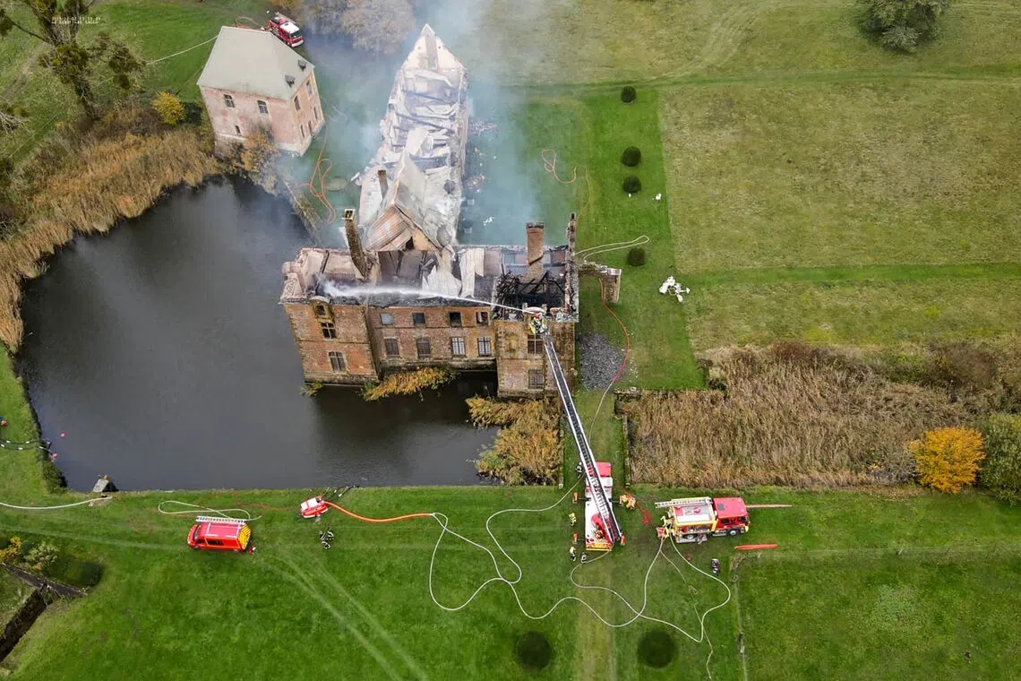 Aerial photograph released on Nov 2, 2025  showing firefighters working on the fire of the former monastery of the Charterhouse of Mont-Dieu, a site listed as a historical monument, in Tannay-le-Mont-Dieu, north-eastern France. 