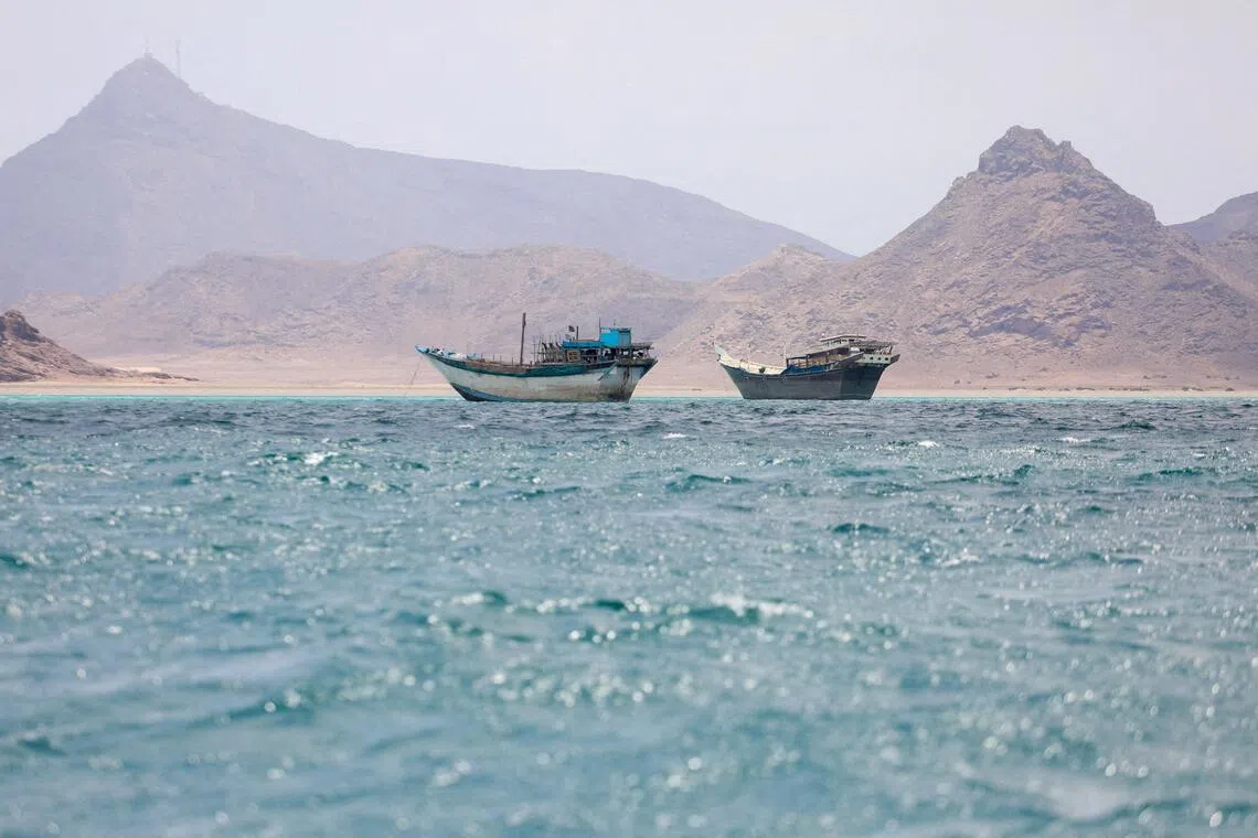 Boats float near the coast of Bab el-Mandeb, Yemen.