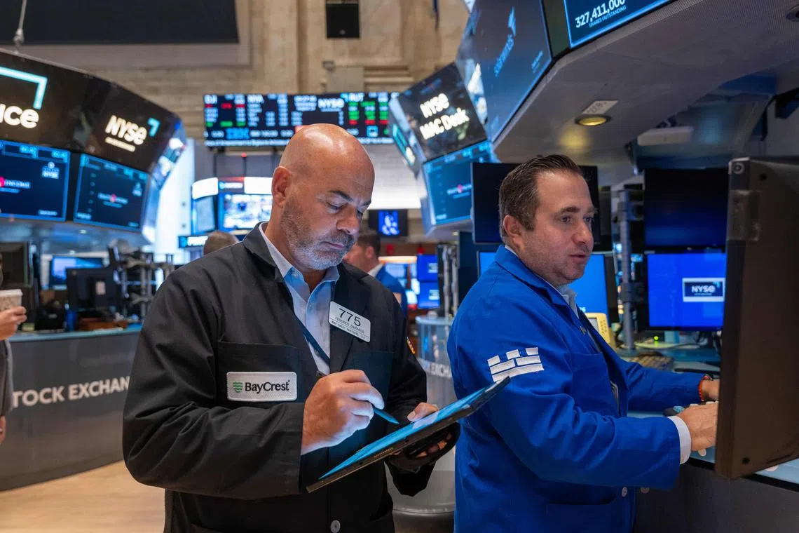 Traders work on the floor of the New York Stock Exchange, on Aug 14, in New York City.