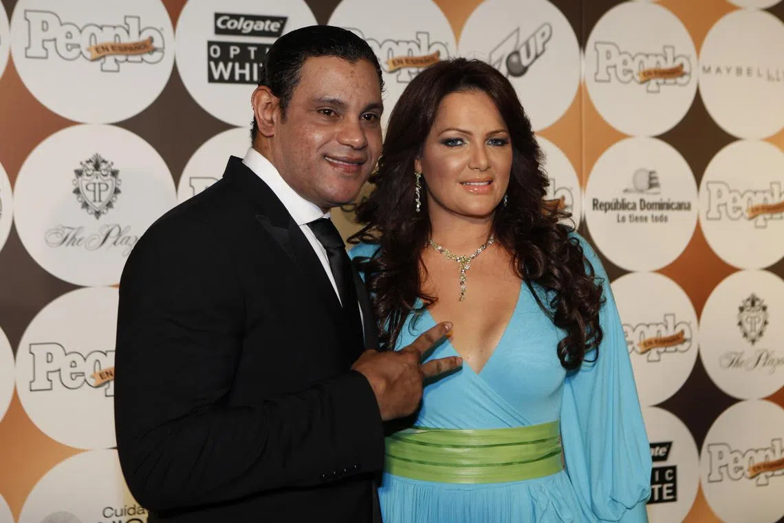 FILE PHOTO: Former MLB baseball player Sammy Sosa (R) and his wife, Sonia, at an event in New York, May 15, 2012.  REUTERS/Eduardo Munoz/File Photo