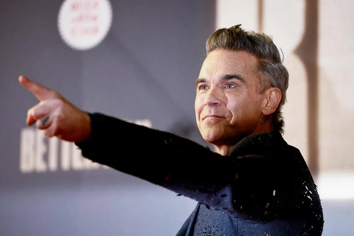 Robbie Williams poses on the red carpet on the day of the screening of "Better Man" at the Auditorium Parco della Musica, in Rome, Italy, December 6, 2024. REUTERS/Yara Nardi