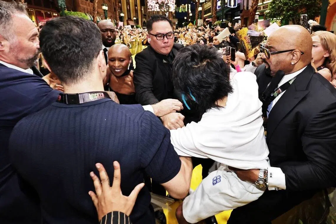 Australian national Johnson Wen jumped the barricade at a fanmeet with the cast of Wicked: For Good on Nov 13, and was promptly caught by security.