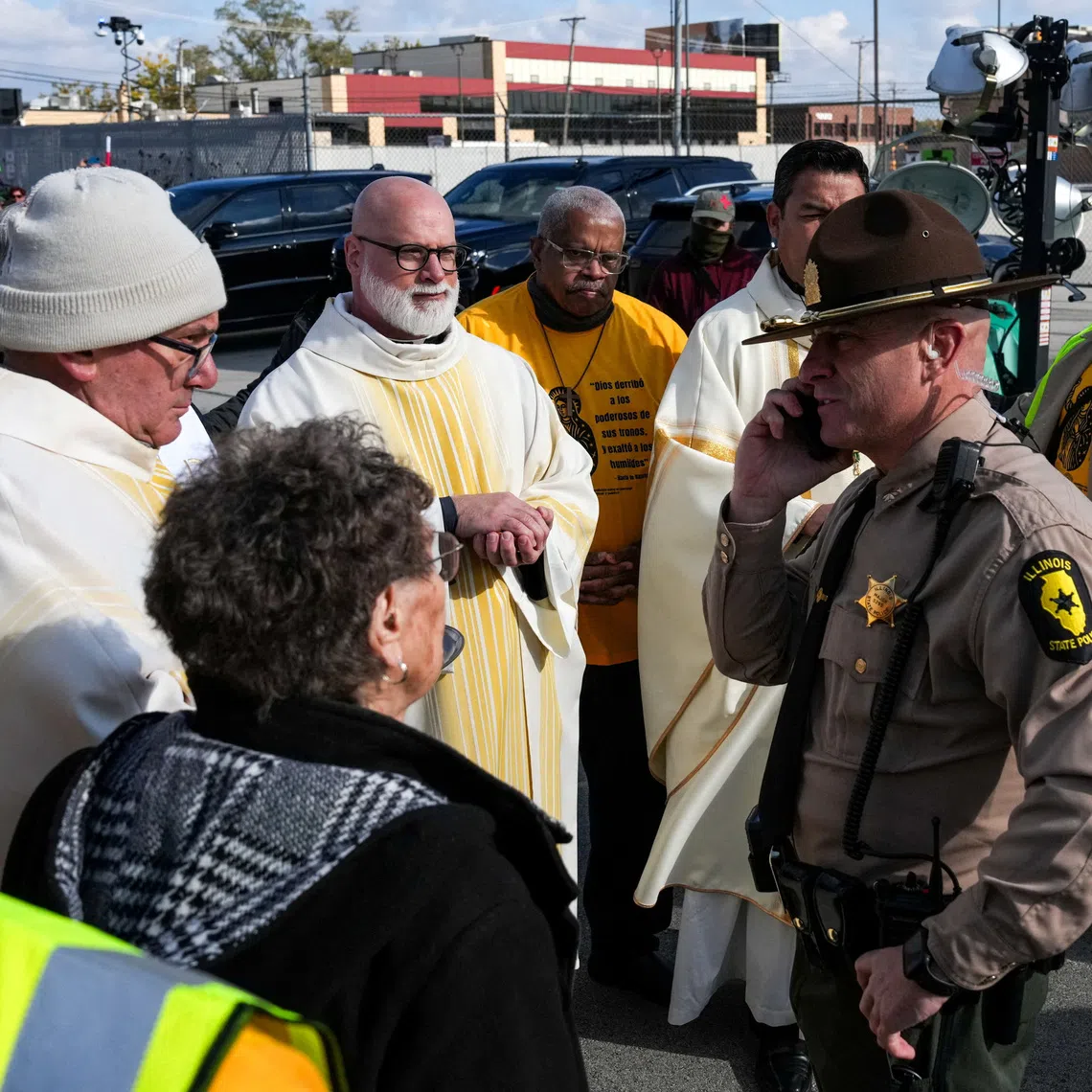 FILE PHOTO: Law enforcement officers prevent religious leaders from entering the Broadview ICE facility and offering communion to immigrants detained inside, during a Catholic Mass, led by Bishop Jose Maria Garcia Maldonado, observed by interfaith leaders, community members, and volunteers,  after U.S. President Donald Trump ordered an increased federal law enforcement presence to assist in crime prevention, in the Chicago suburb of Broadview, Illinois, U.S., November 1, 2025. REUTERS/Leah Millis/ File Photo/File Photo