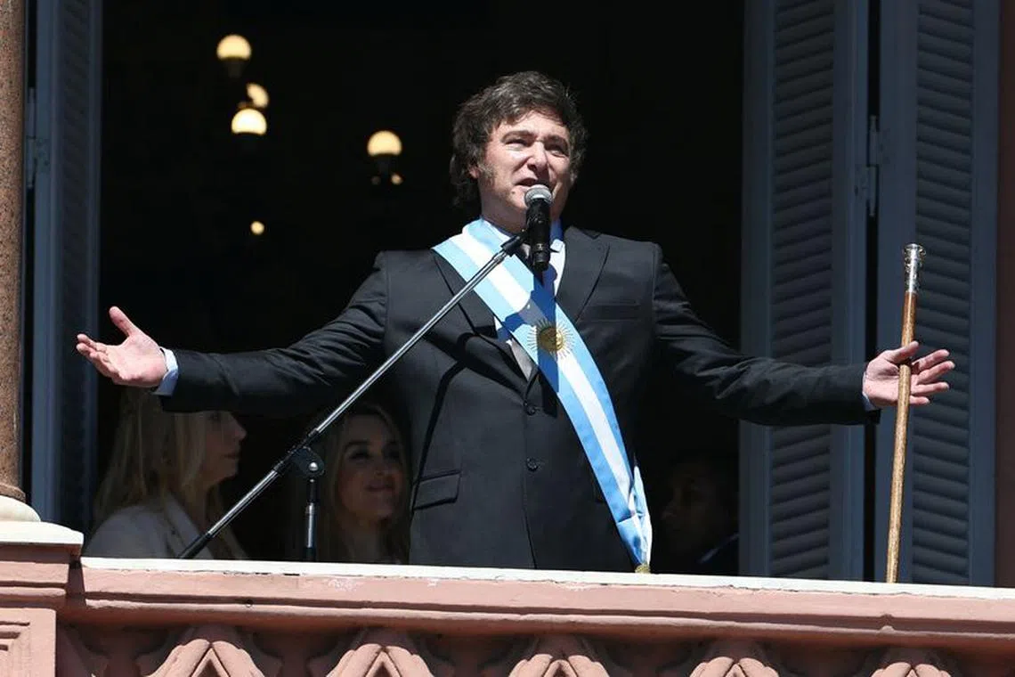 Argentina's President Javier Milei addresses supporters from the Casa Rosada balcony, as his sister Karina Milei and his partner Fatima Florez look on, after his swearing-in ceremony, in Buenos Aires, Argentina December 10, 2023. REUTERS/Agustin Marcarian/ File Photo