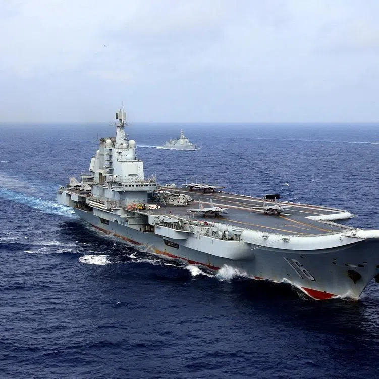 FILE PHOTO: China's aircraft carrier Liaoning takes part in a military drill of Chinese People's Liberation Army (PLA) Navy in the western Pacific Ocean, April 18, 2018.  REUTERS/Stringer File Photo