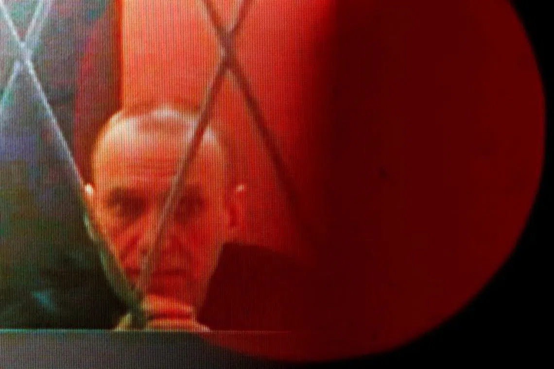 Russian opposition leader Alexei Navalny appears on a screen via a video link from the IK-3 penal colony in Kharp in the Yamal-Nenets region during a hearing against the Ministry of Justice in Supreme Court, in Moscow, Russia, January 11, 2024. REUTERS/Maxim Shemetov