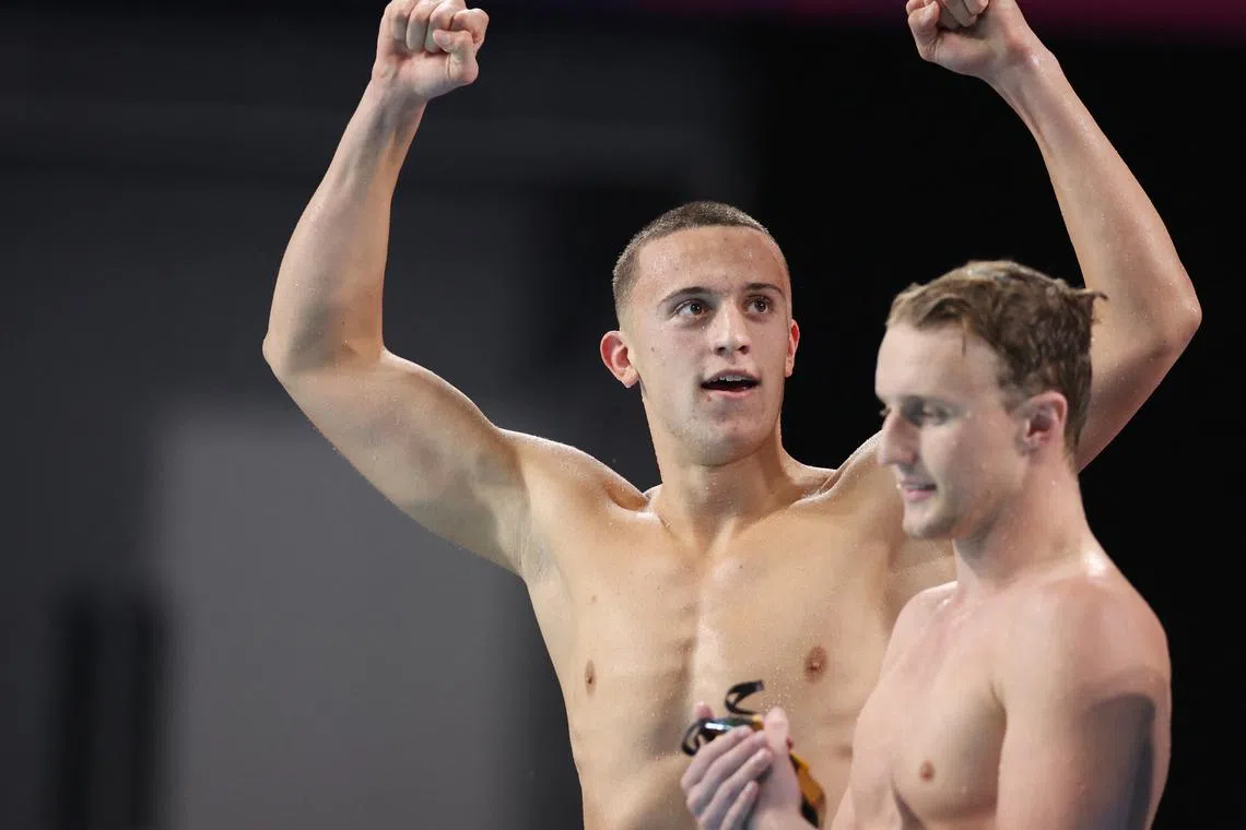 Commonwealth Games - Swimming - Men's 4 x 200m Freestyle Relay- Final - Sandwell Aquatics Centre, Birmingham, Britain - August 1, 2022 Australia's Flynn Southam and Elijah Winnington celebrate after winning gold REUTERS/Stoyan Nenov/File Photo