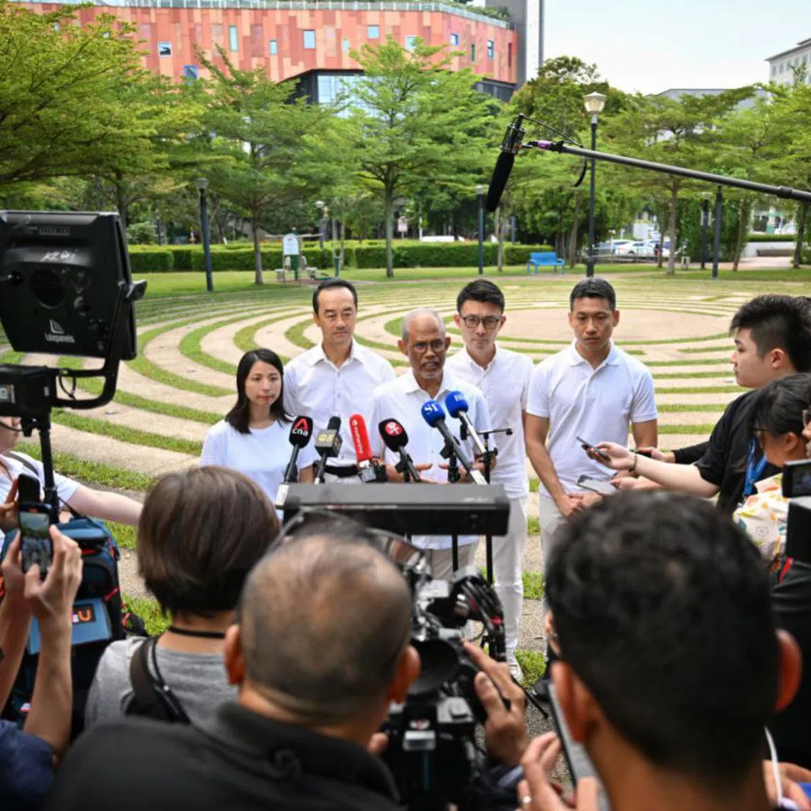 Minister-in-charge of Muslim Affairs Masagos Zulkifli (centre) with members of the PAP Tampines GRC team in Tampines Avenue 4 on April 26.