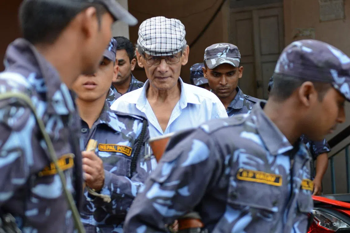 In this file photo taken on Jun 12, 2014, French serial killer Charles Sobhraj (C) is escorted by Nepalese police at a district court.
